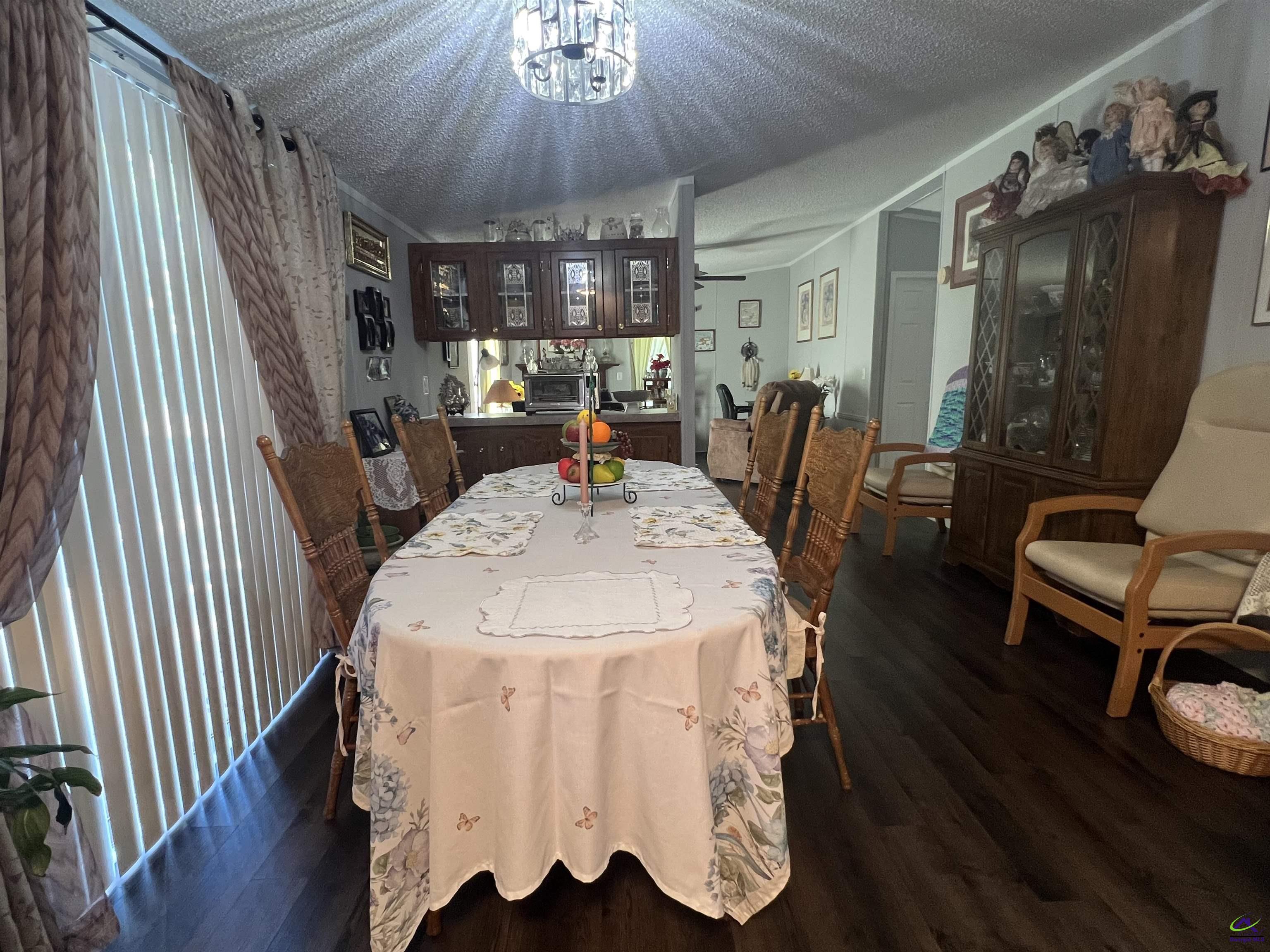 166 Pebble Hills Road Cochran, GA 31014 - Photo 15 of 27 a view of a dining room with furniture window and wooden floor