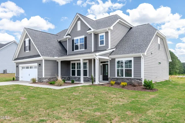 front view of a house with a yard