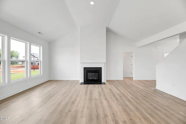 a kitchen with a sink a stove and cabinets