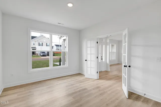 a view of an empty room with a window