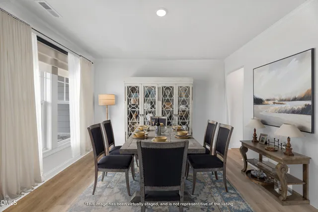 a view of a dining room with furniture window and outside view