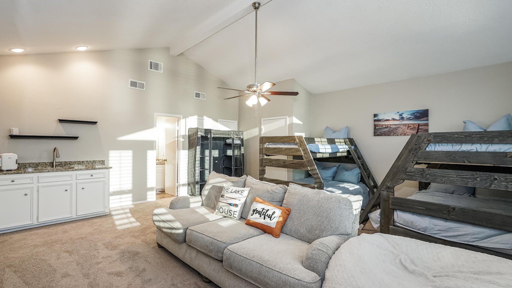 129 Capetown Conroe, TX 77356 - Photo 20 of 35 From this angle of the fourth bedroom you can see there is a wet bar with a utility sink.