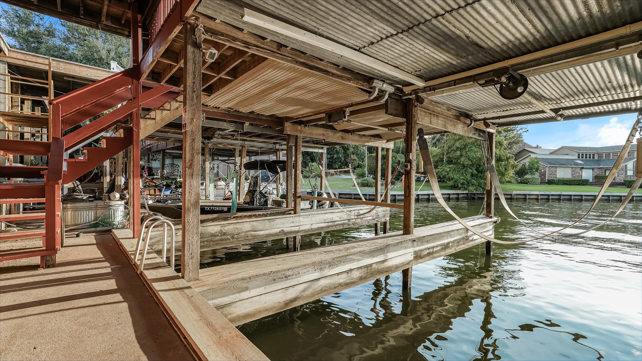 129 Capetown Conroe, TX 77356 - Photo 32 of 35 There is also a stair rail where you can jump into the water and go for a nice swim.
