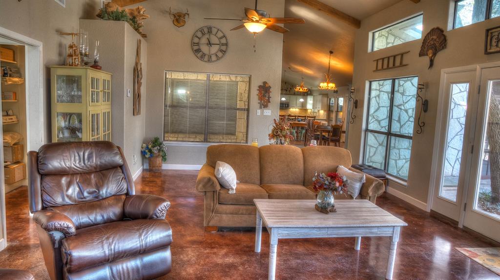 187 Roy Chisum Road Leakey, TX 78873 - Photo 13 of 40 a living room with furniture and a floor to ceiling window
