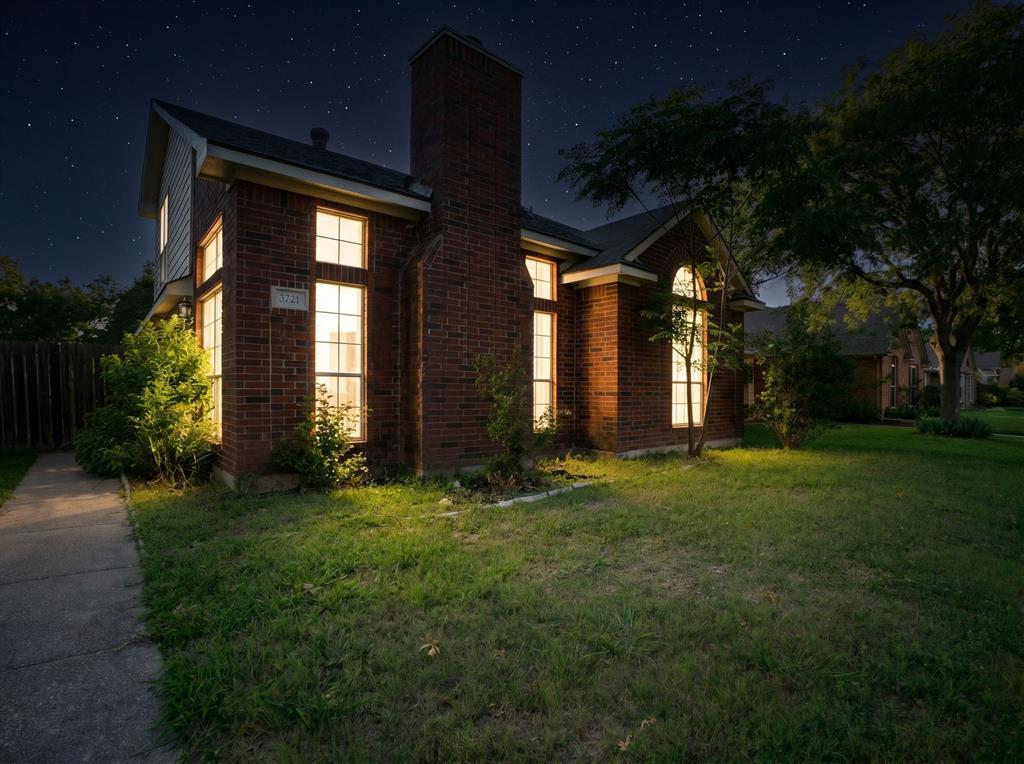 3721 Smartt Street Rowlett, TX 75088 - Photo 25 of 27 a front view of house with yard and green space
