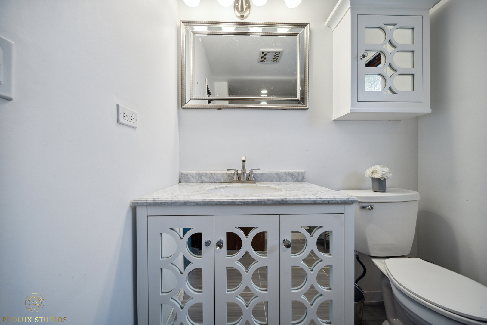 848 Willowbrook Drive Wheeling, IL 60090 - Photo 14 of 23 a bathroom with a granite countertop toilet sink and mirror