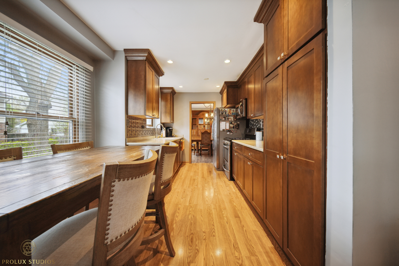 848 Willowbrook Drive Wheeling, IL 60090 - Photo 7 of 23 a view of a kitchen with kitchen island a large window a sink and stainless steel appliances