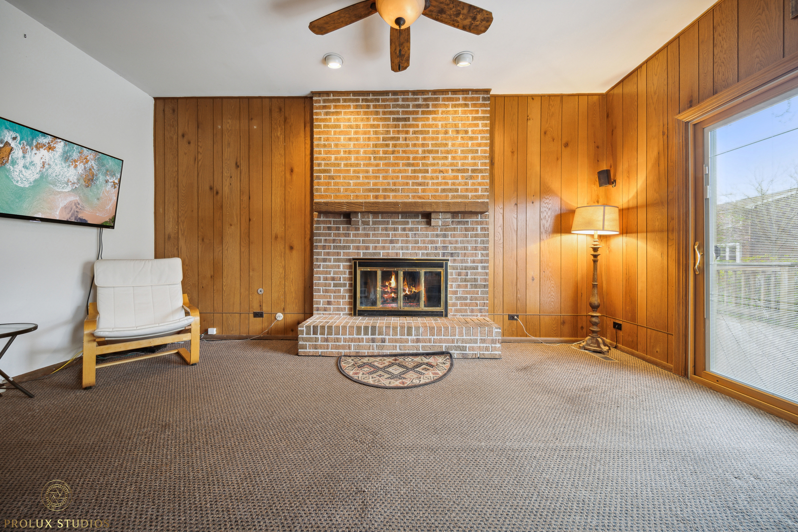 848 Willowbrook Drive Wheeling, IL 60090 - Photo 8 of 23 a living room with furniture and a fireplace