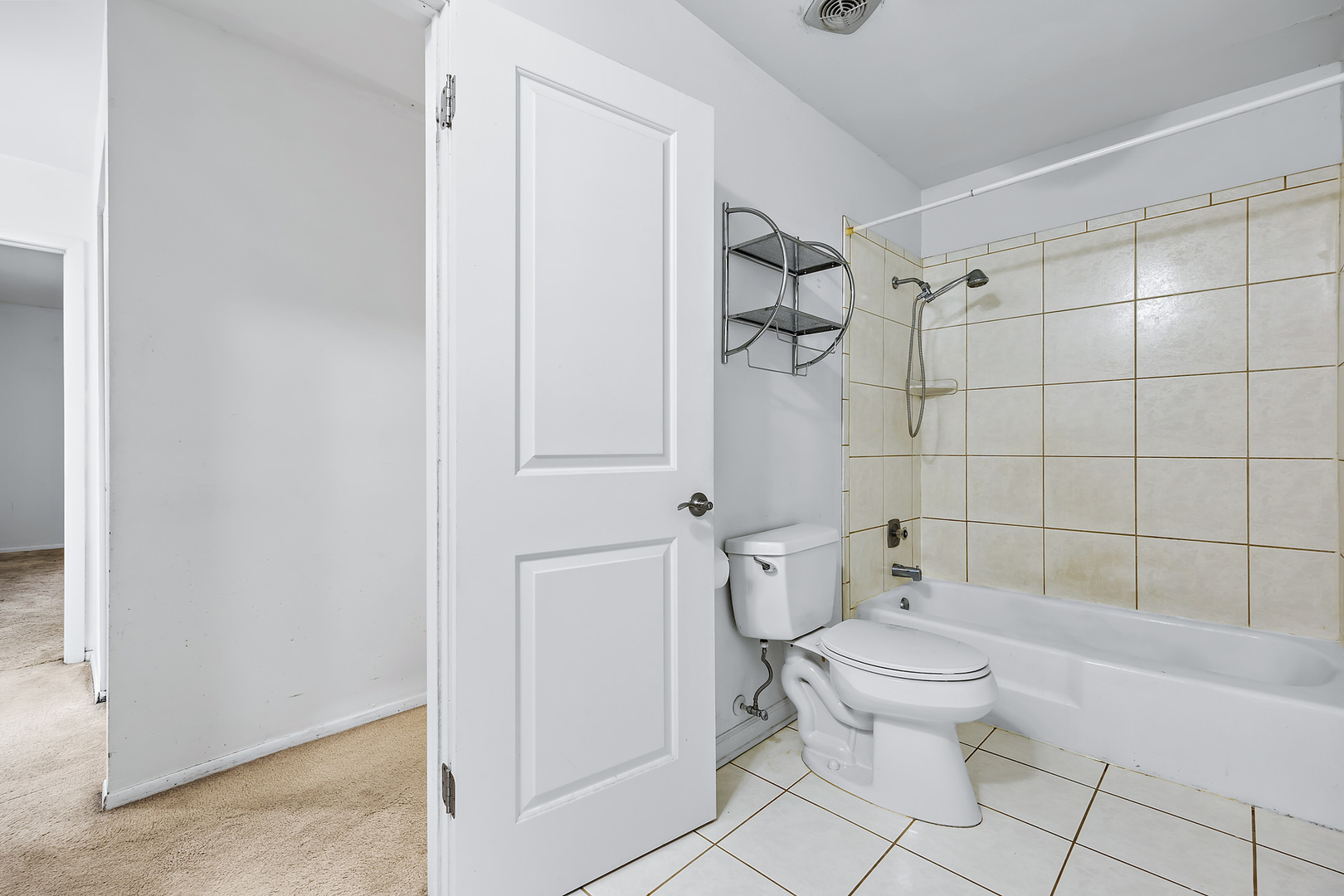 1105 Rhodes Court Wheaton, IL 60189 - Photo 11 of 22 a white toilet sitting next to a bathroom sink
