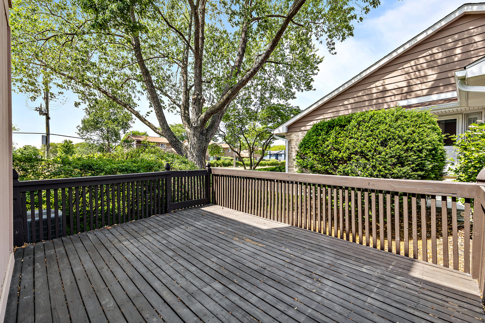 1105 Rhodes Court Wheaton, IL 60189 - Photo 17 of 22 a view of balcony with wooden floor and fence
