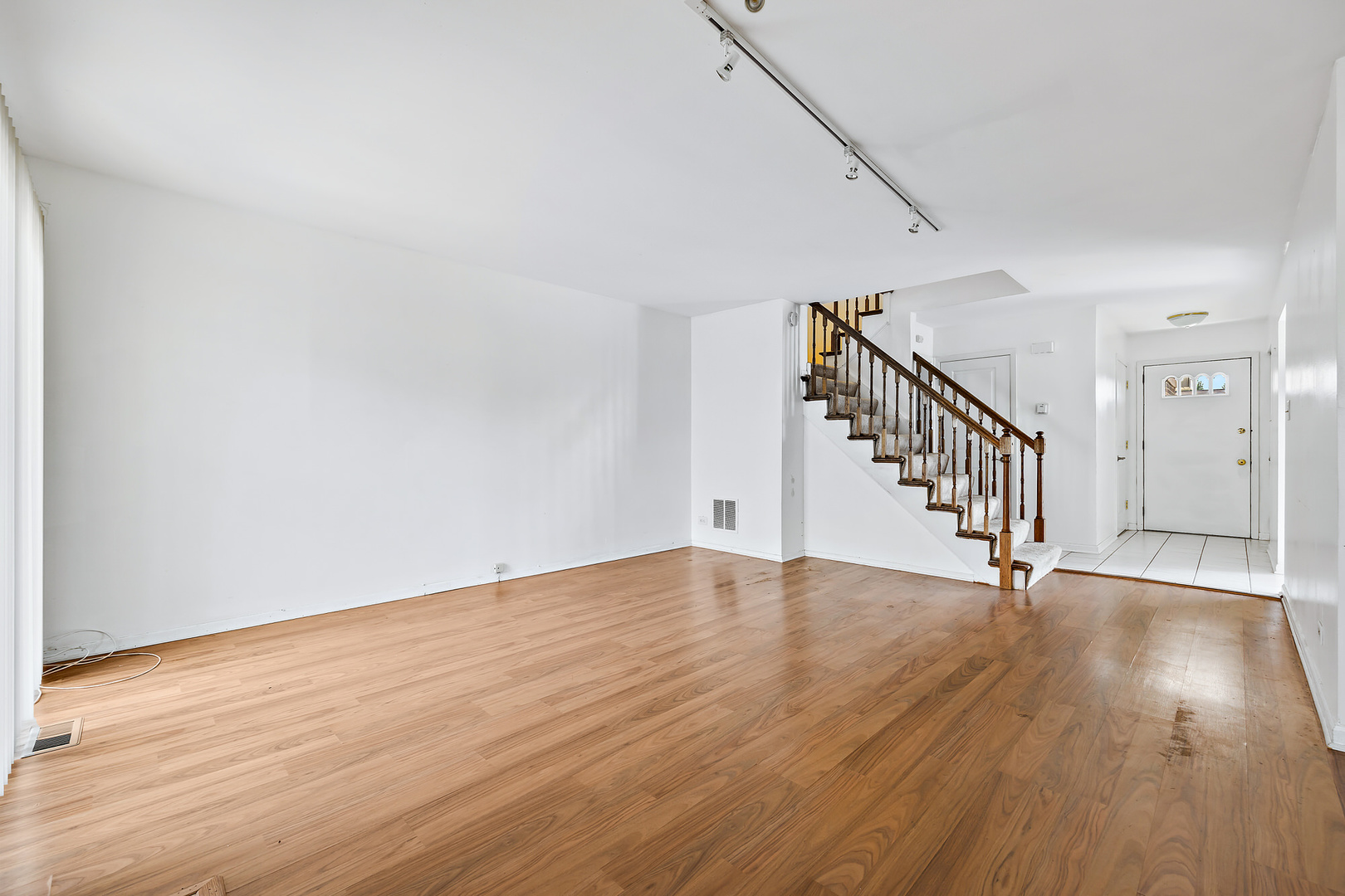 1105 Rhodes Court Wheaton, IL 60189 - Photo 5 of 22 a view of an empty room with wooden floor