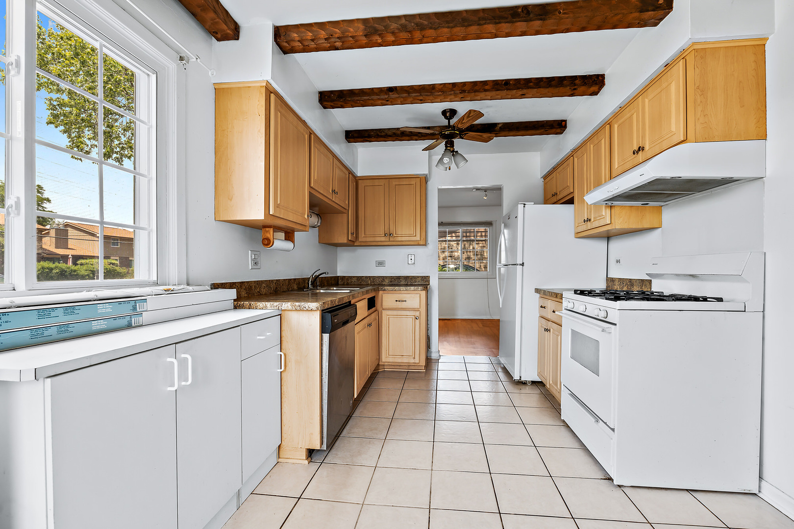1105 Rhodes Court Wheaton, IL 60189 - Photo 6 of 22 a kitchen with stainless steel appliances granite countertop a stove and a sink