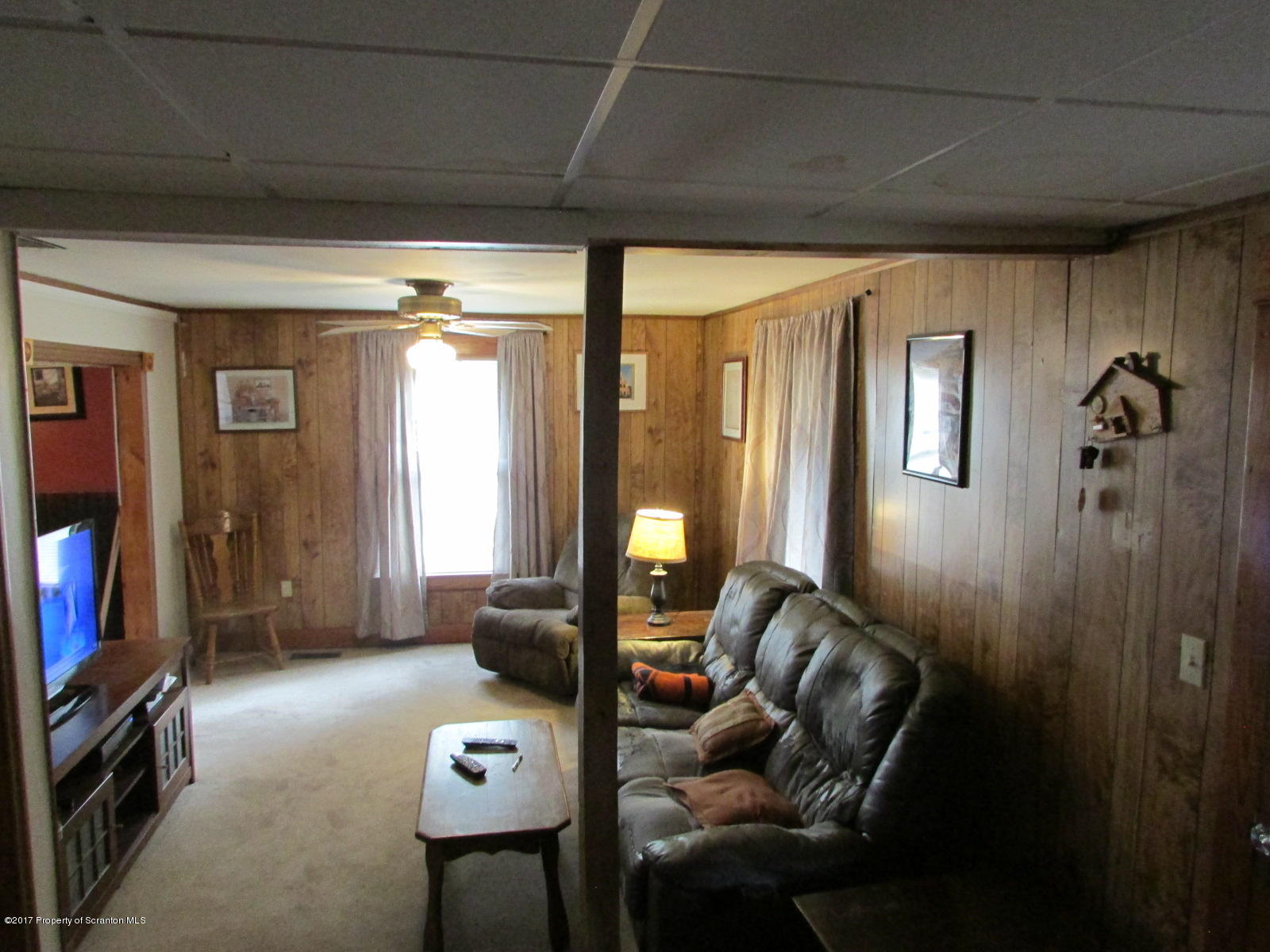 228 Ridge Road South Montrose, PA 18801 - Photo 3 of 20 a living room with furniture and a flat screen tv