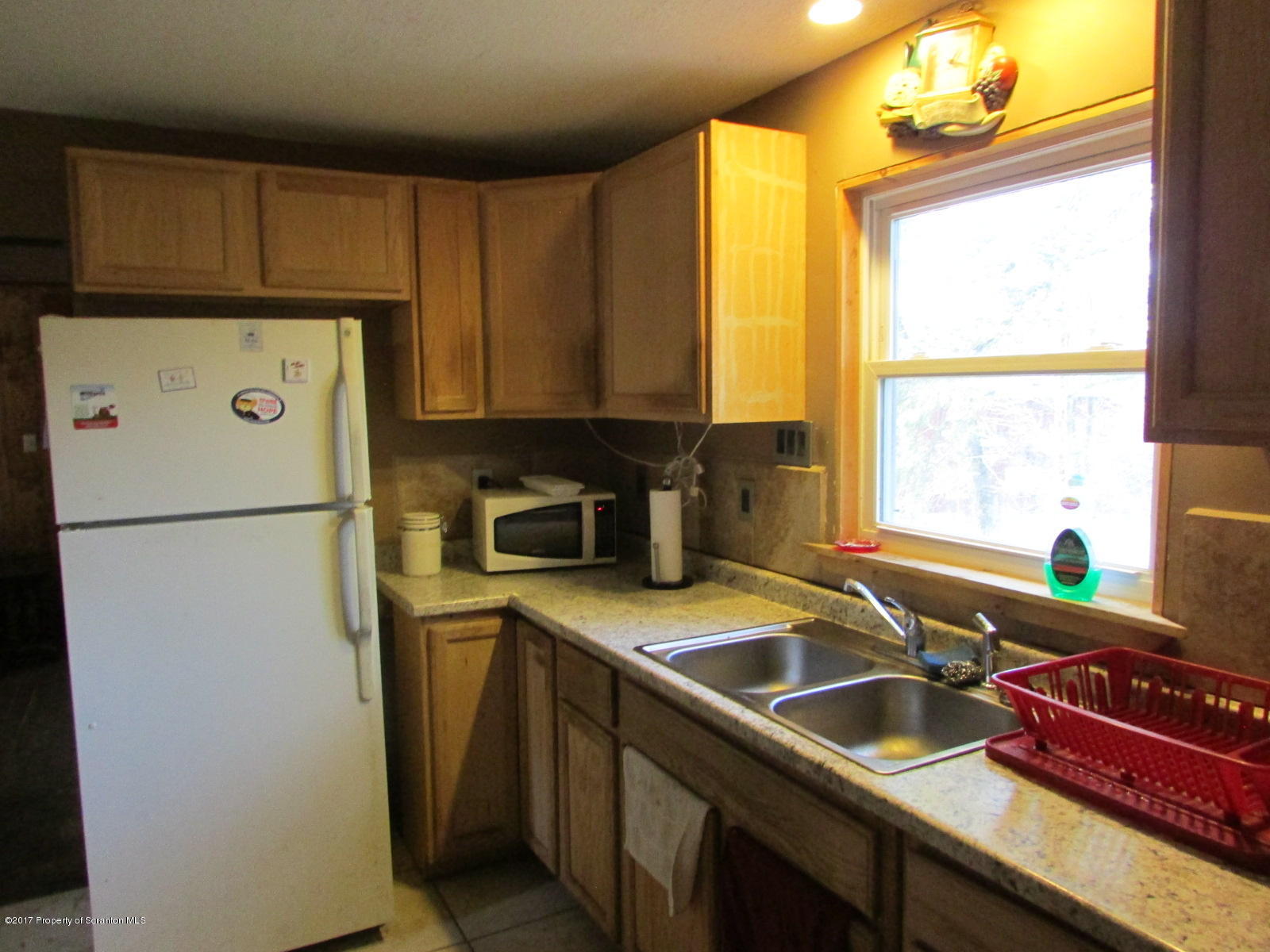 228 Ridge Road South Montrose, PA 18801 - Photo 7 of 20 a kitchen with a refrigerator and a sink