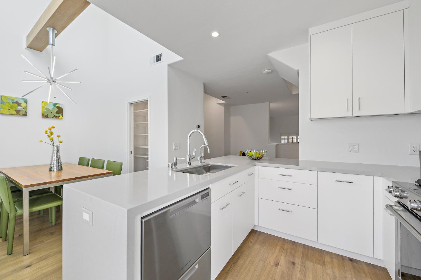 135 Pacchetti Way Mountain View, CA 94040 - Photo 11 of 27 a kitchen with a sink cabinets and wooden floor