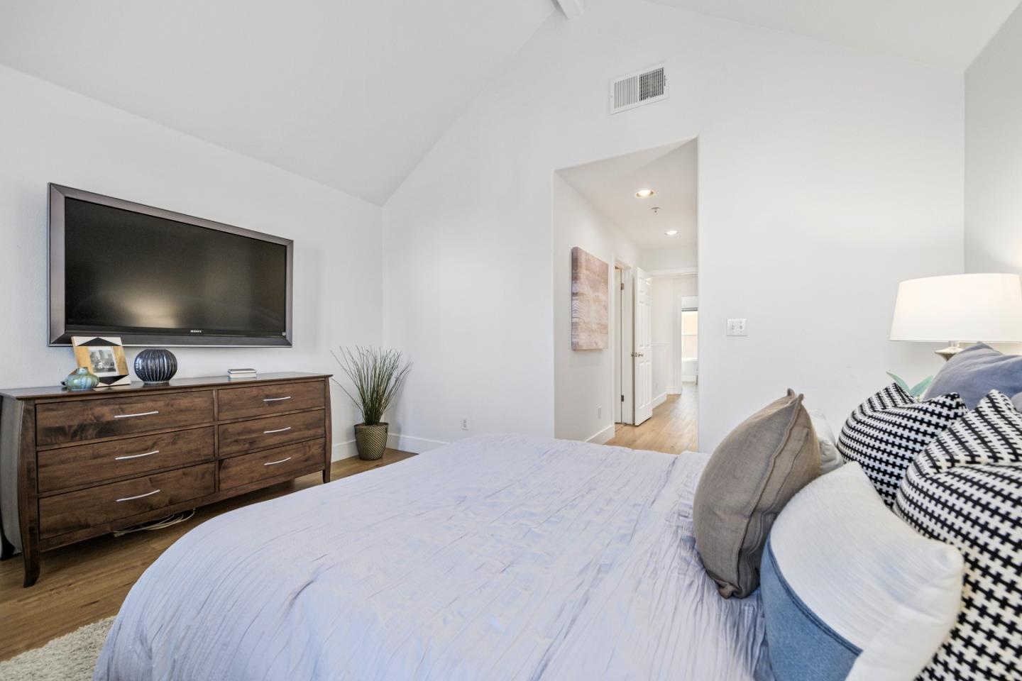 135 Pacchetti Way Mountain View, CA 94040 - Photo 16 of 27 a bedroom with a bed and a flat screen tv