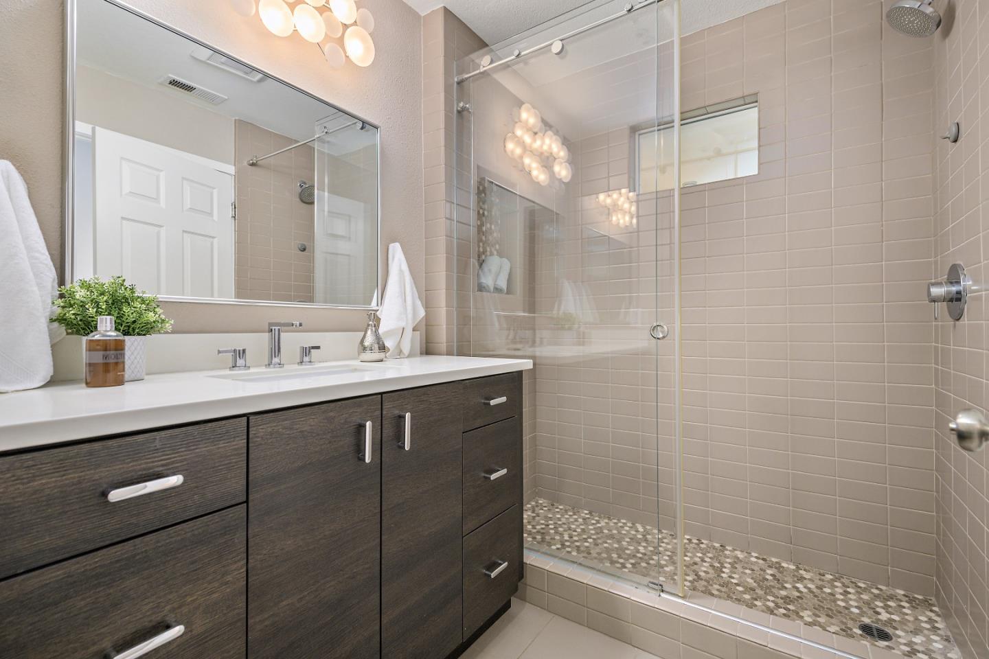 135 Pacchetti Way Mountain View, CA 94040 - Photo 18 of 27 a bathroom with a shower sink and mirror