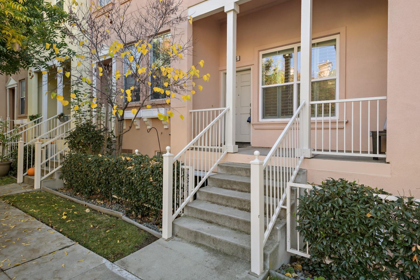 135 Pacchetti Way Mountain View, CA 94040 - Photo 2 of 27 a view of a house with a small yard and flower plants