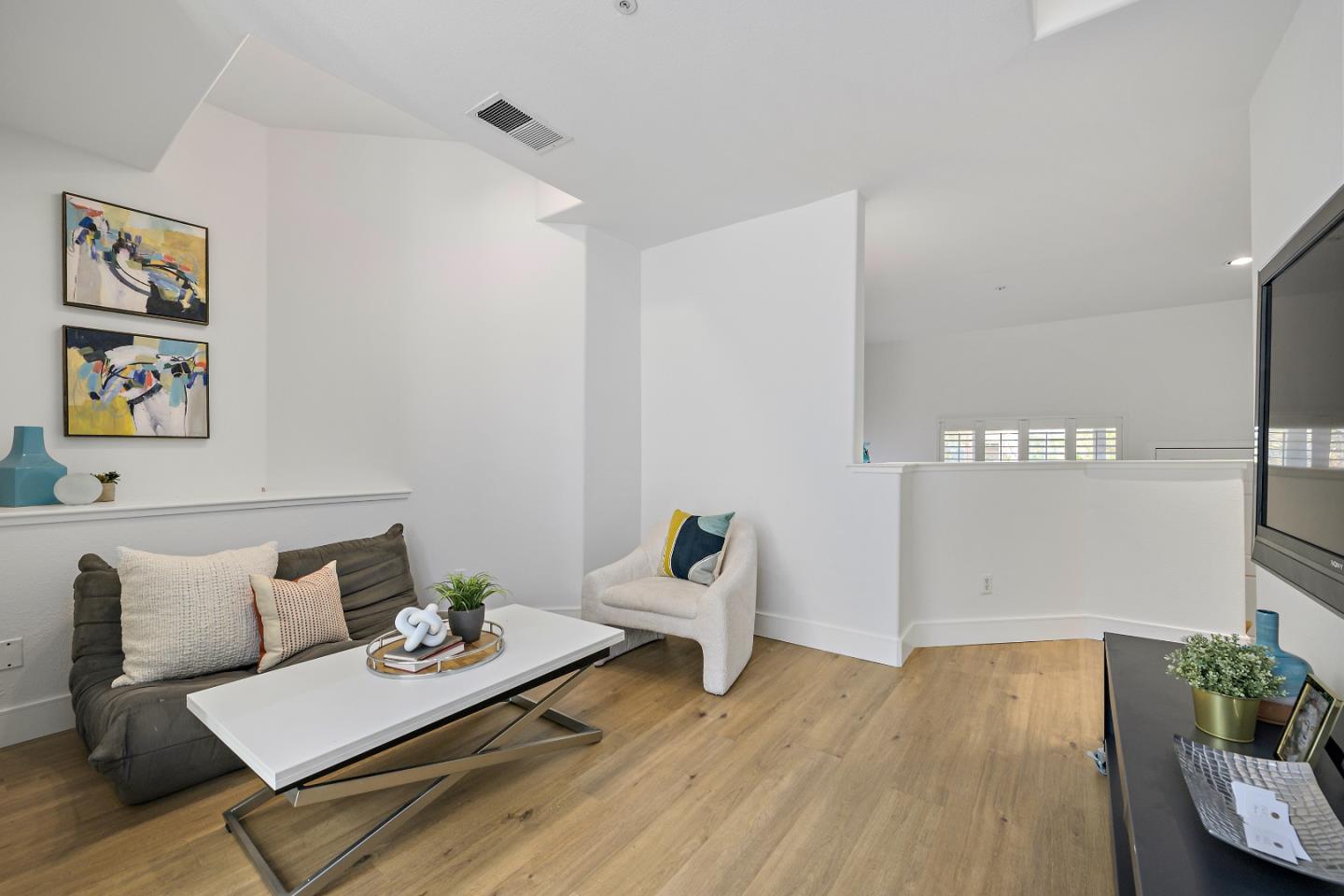 135 Pacchetti Way Mountain View, CA 94040 - Photo 5 of 27 a living room with furniture and wooden floor