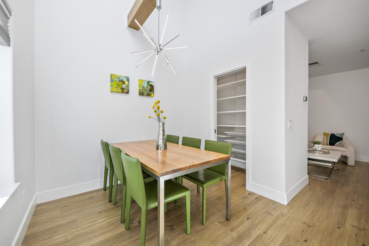 135 Pacchetti Way Mountain View, CA 94040 - Photo 8 of 27 a view of a dining room with furniture and wooden floor