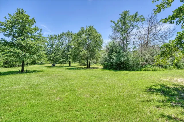 a view of outdoor space with deck and yard