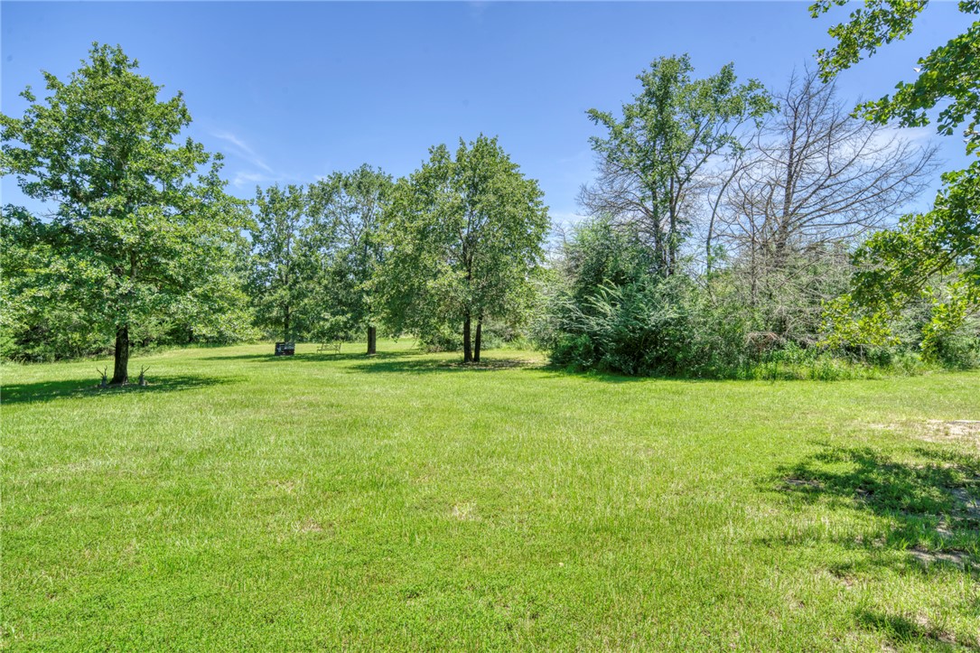 9945 Oxford Cemetery Road Madisonville, TX 77864 - Photo 31 of 42 a view of outdoor space with deck and yard