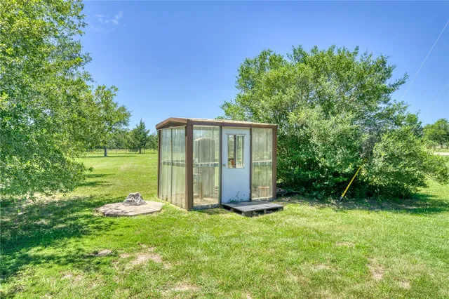 a view of a barn with a yard