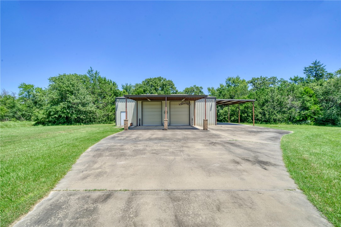 9945 Oxford Cemetery Road Madisonville, TX 77864 - Photo 33 of 42 front view of a house with a yard