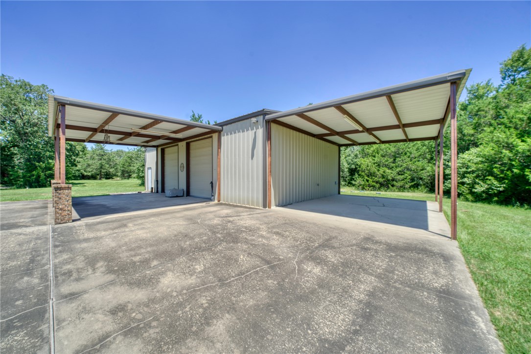 9945 Oxford Cemetery Road Madisonville, TX 77864 - Photo 34 of 42 a view of a backyard of a house