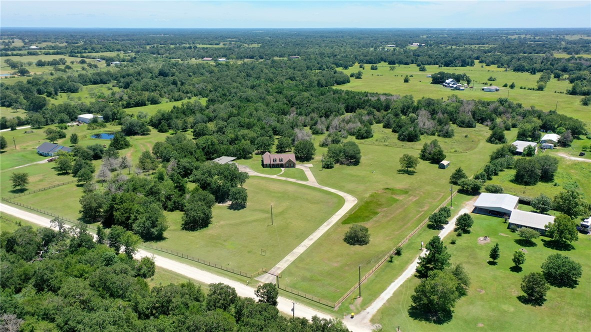 9945 Oxford Cemetery Road Madisonville, TX 77864 - Photo 41 of 42 an aerial view of a residential houses with outdoor space and trees