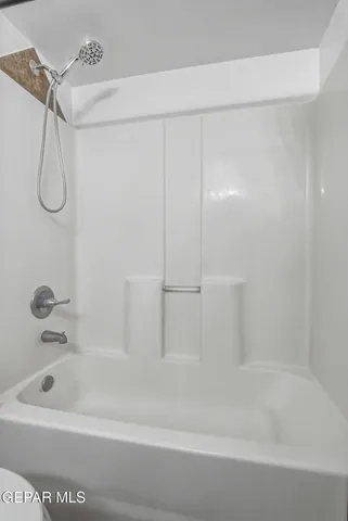 a bathroom with a bath tub
