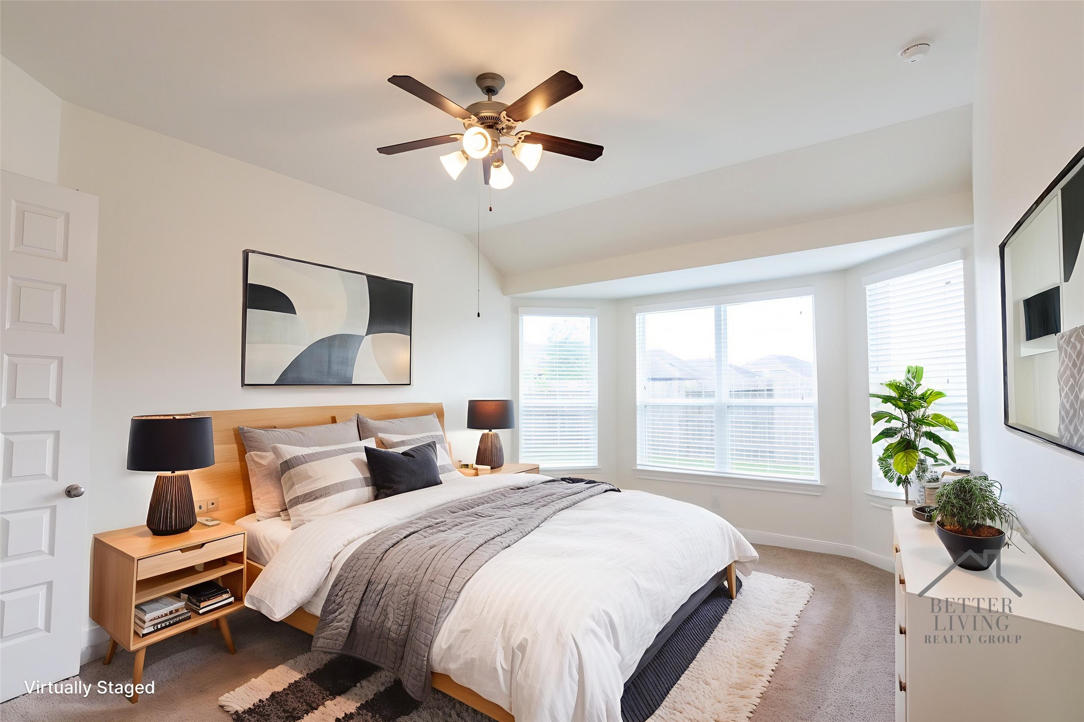 2312 Jessamine Heights Lane Pearland, TX 77089 - Photo 20 of 49 a bedroom with a large bed and a chandelier