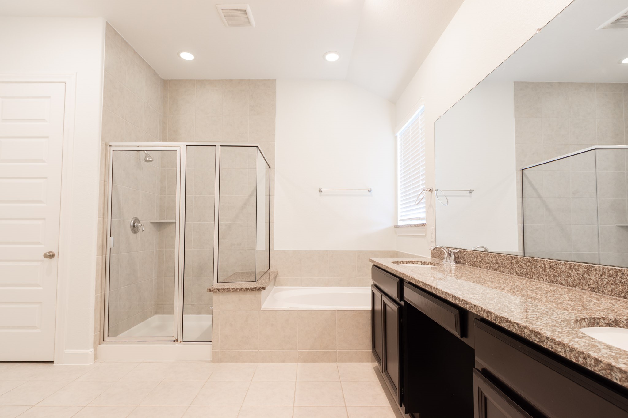 2312 Jessamine Heights Lane Pearland, TX 77089 - Photo 22 of 49 a bathroom with a granite countertop sink and a mirror