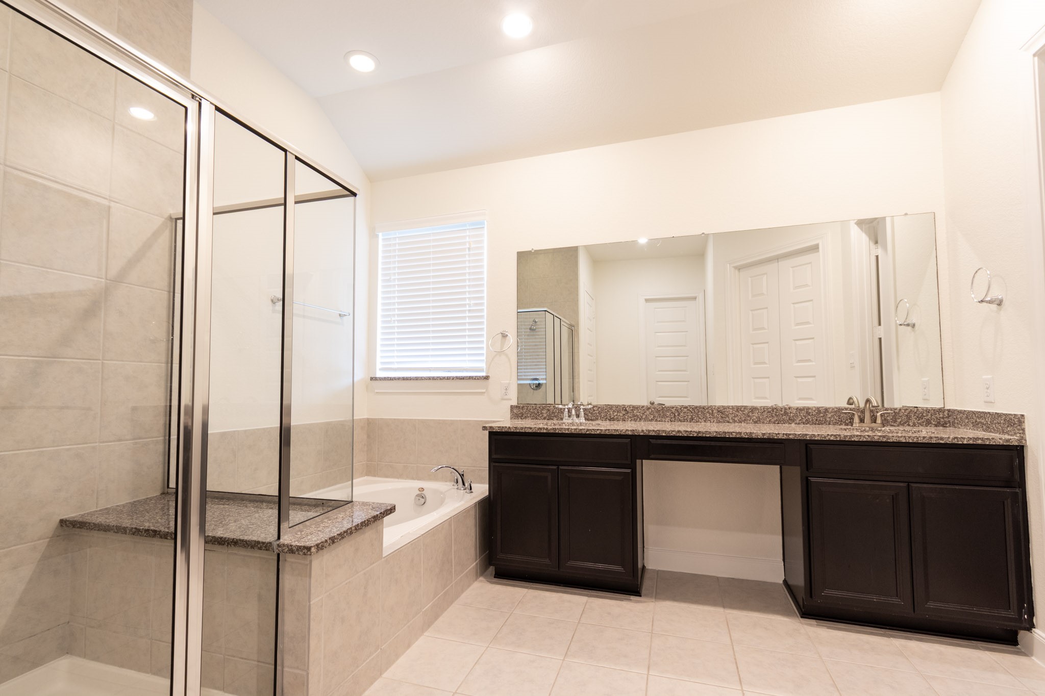 2312 Jessamine Heights Lane Pearland, TX 77089 - Photo 24 of 49 a kitchen with a sink and cabinets