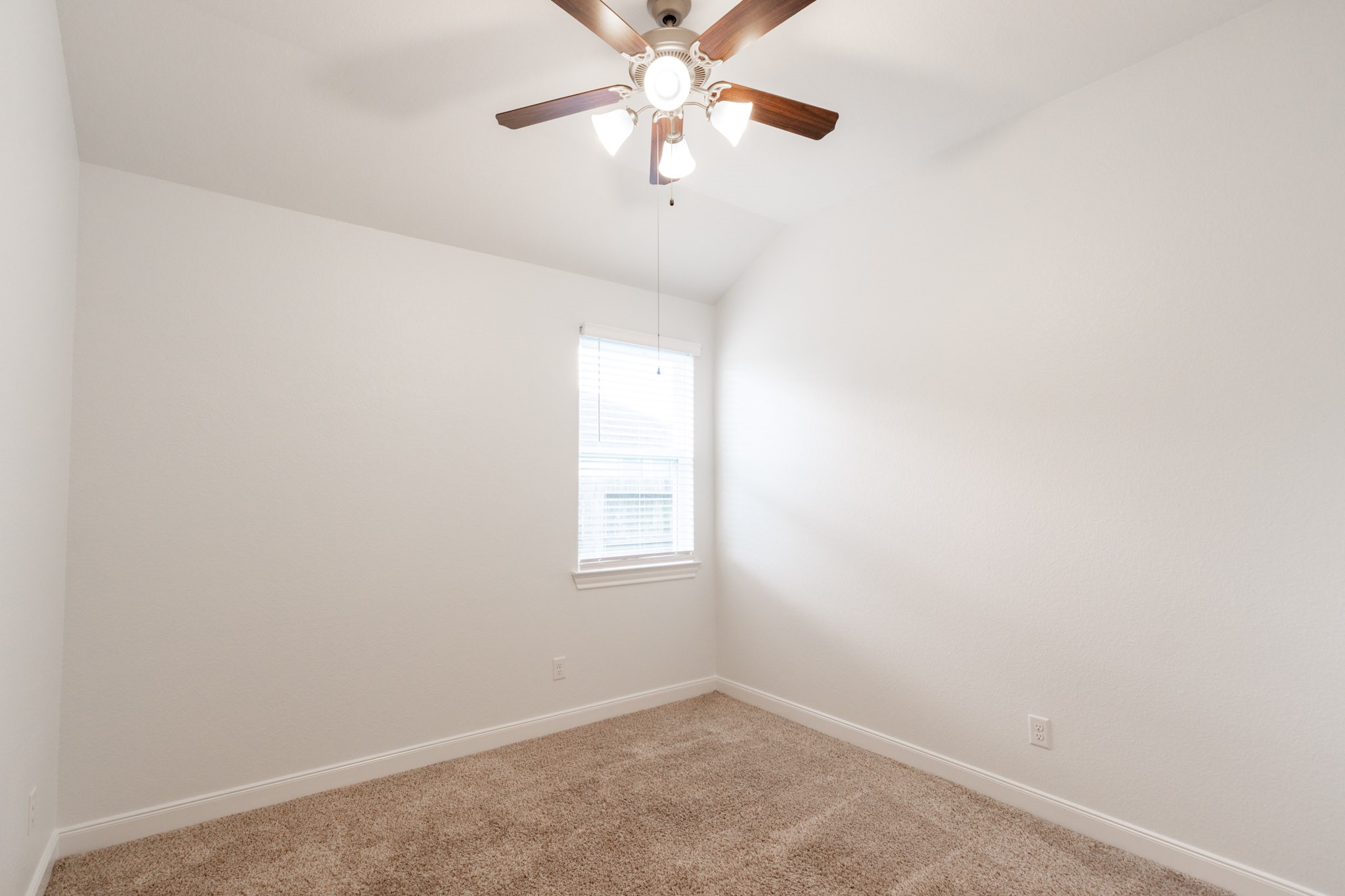 2312 Jessamine Heights Lane Pearland, TX 77089 - Photo 28 of 49 an empty room with a window and a fan