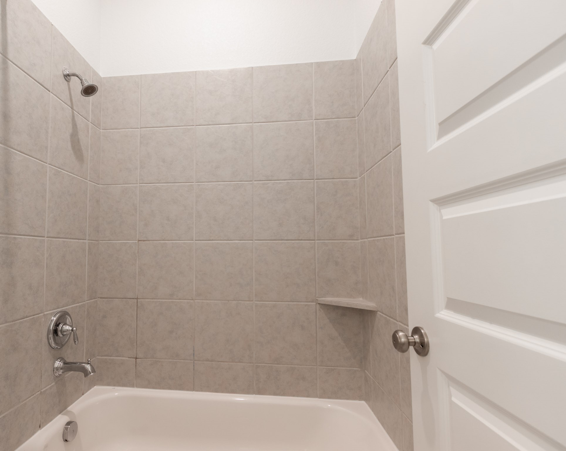 2312 Jessamine Heights Lane Pearland, TX 77089 - Photo 35 of 49 a close up of a bathtub in a bathroom