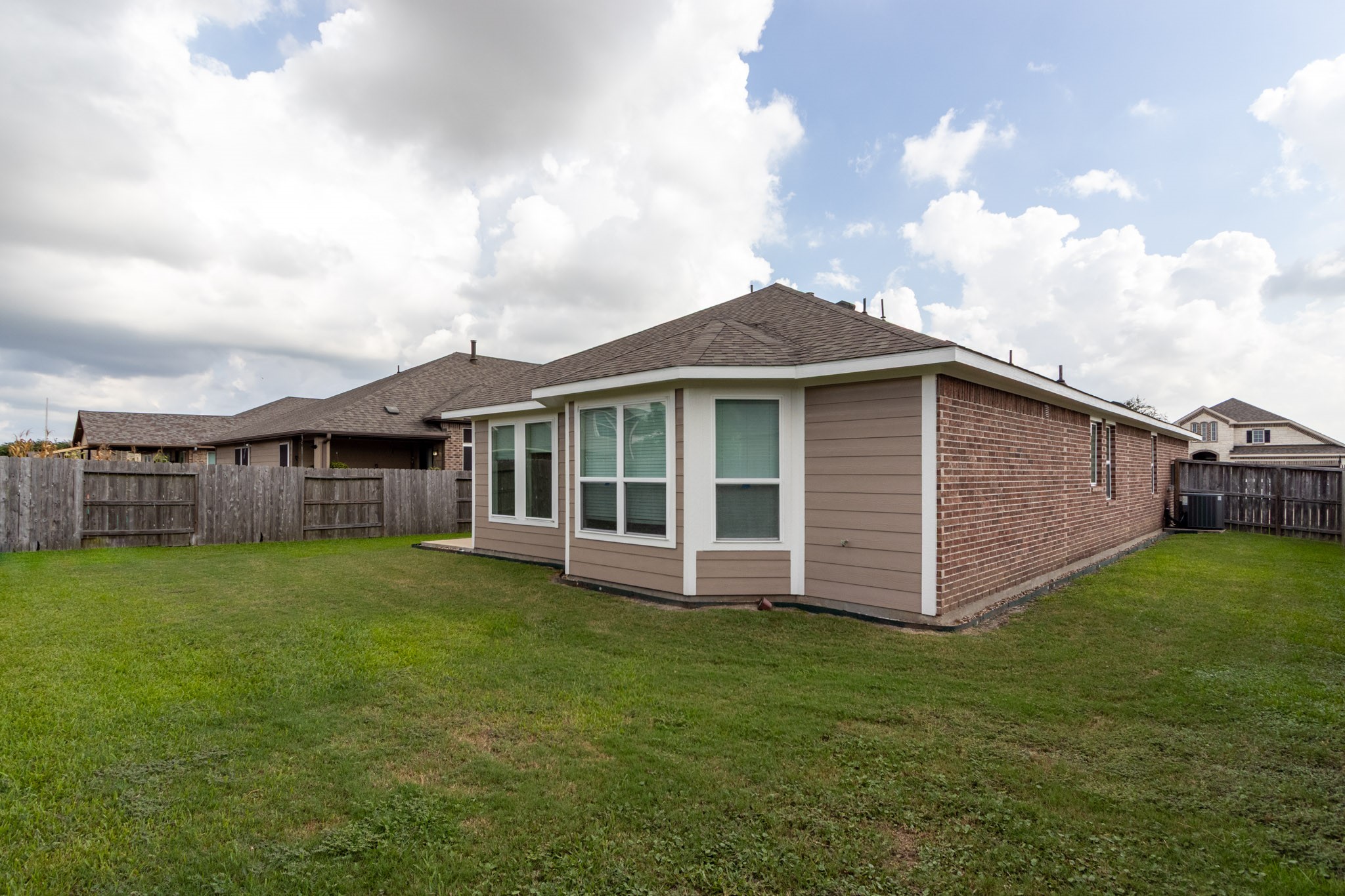 2312 Jessamine Heights Lane Pearland, TX 77089 - Photo 39 of 49 a view of a house with a yard