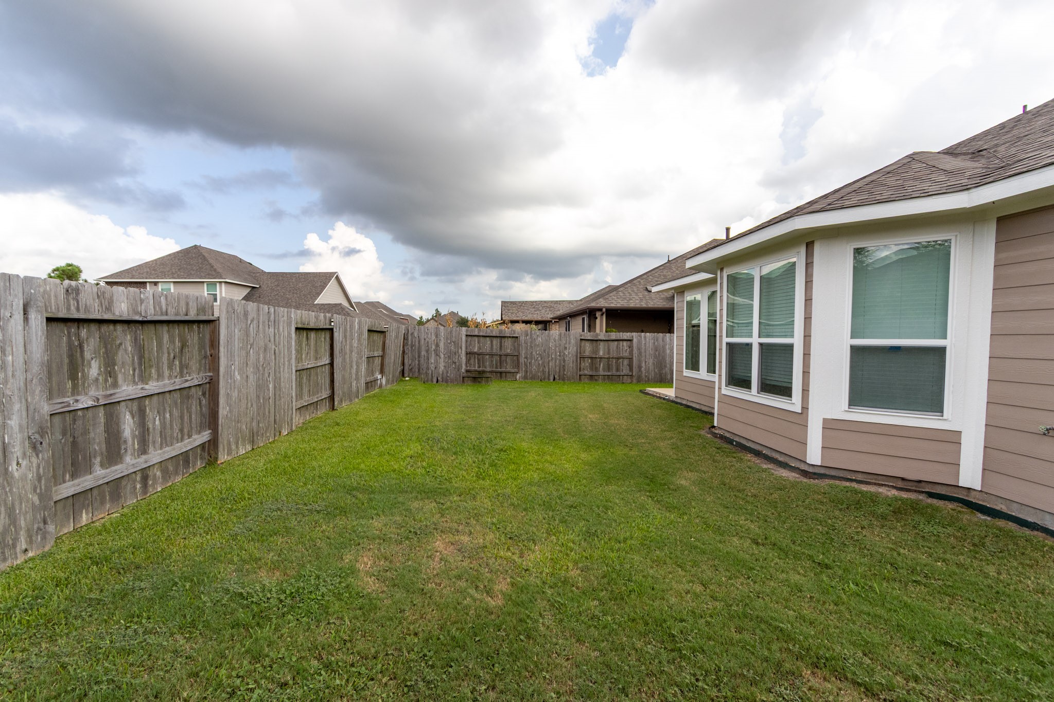 2312 Jessamine Heights Lane Pearland, TX 77089 - Photo 40 of 49 a view of a house with a backyard