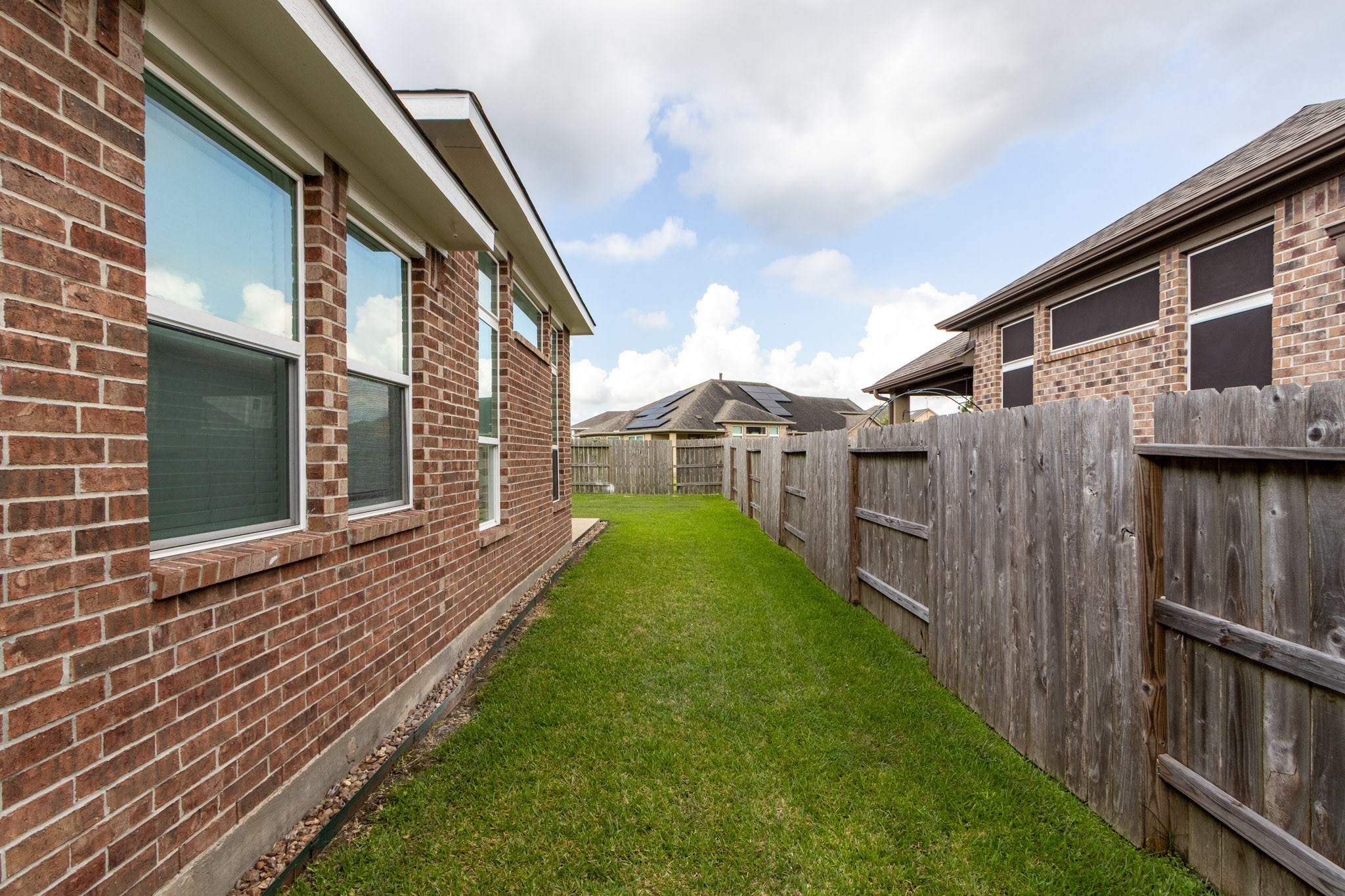 2312 Jessamine Heights Lane Pearland, TX 77089 - Photo 42 of 49 a view of a house with backyard and porch