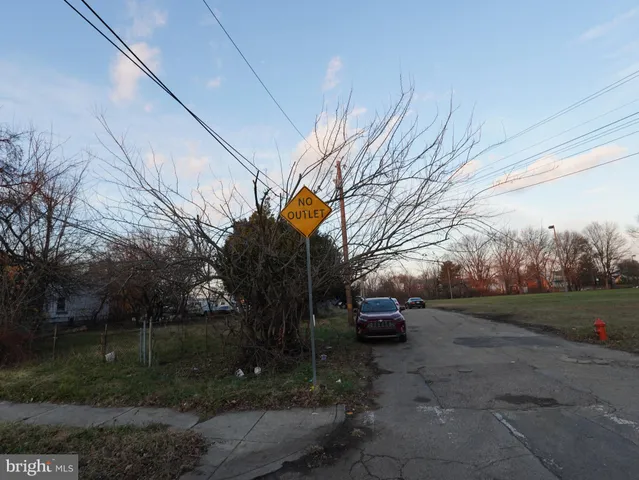 a view of a street with a house