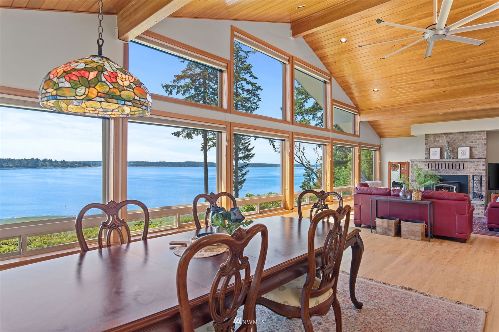 17510 88th Street Southwest Longbranch, WA 98351 - Photo 14 of 40 a view of a dining room with furniture one side kitchen view and wooden floor