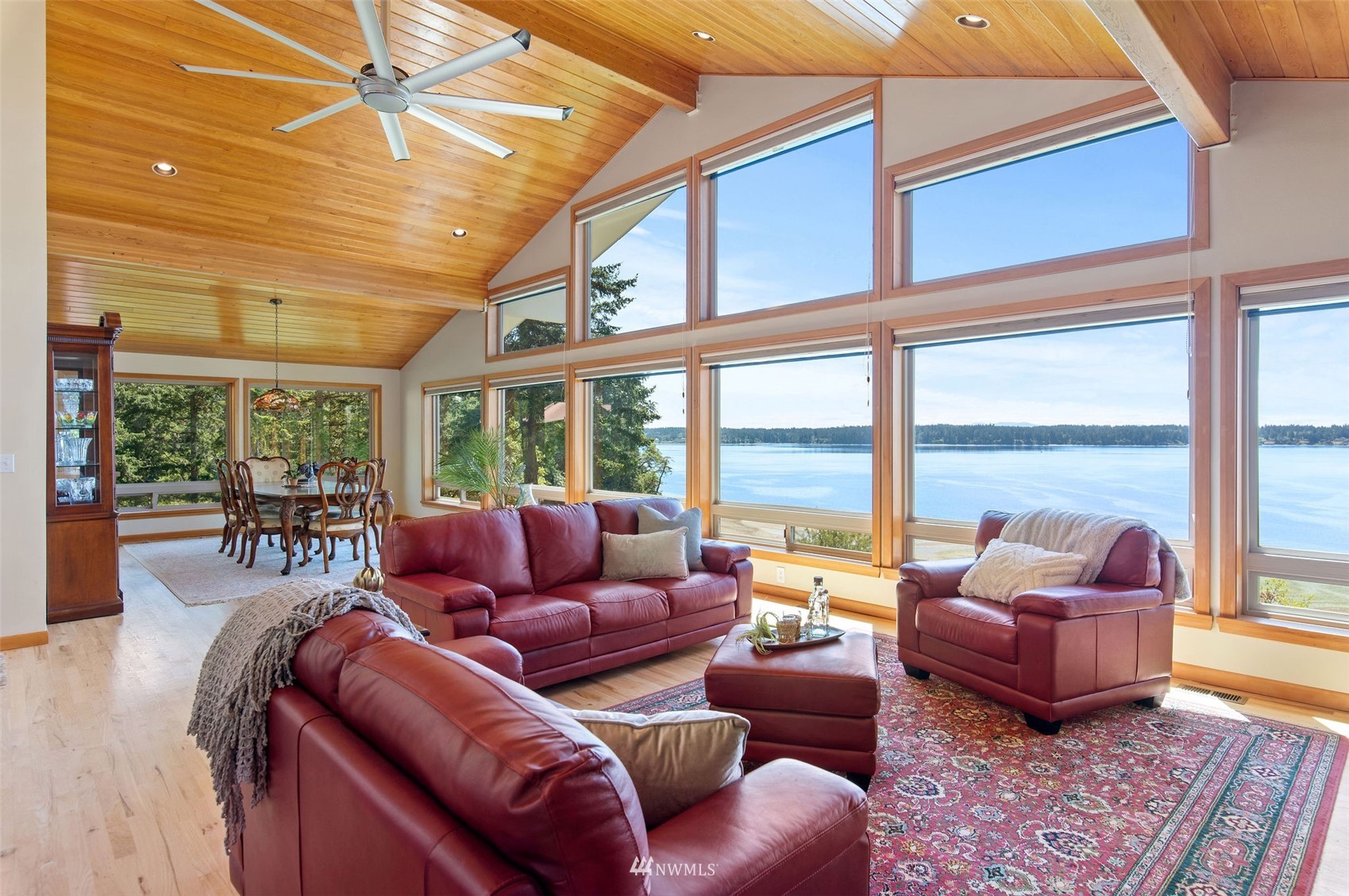 17510 88th Street Southwest Longbranch, WA 98351 - Photo 17 of 40 a living room with furniture and floor to ceiling windows
