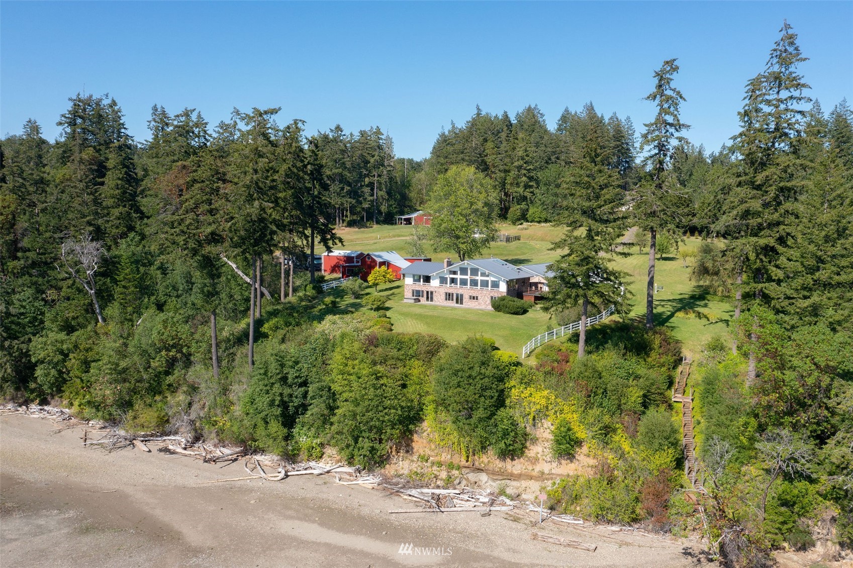 17510 88th Street Southwest Longbranch, WA 98351 - Photo 2 of 40 a view of a street with a building in the background