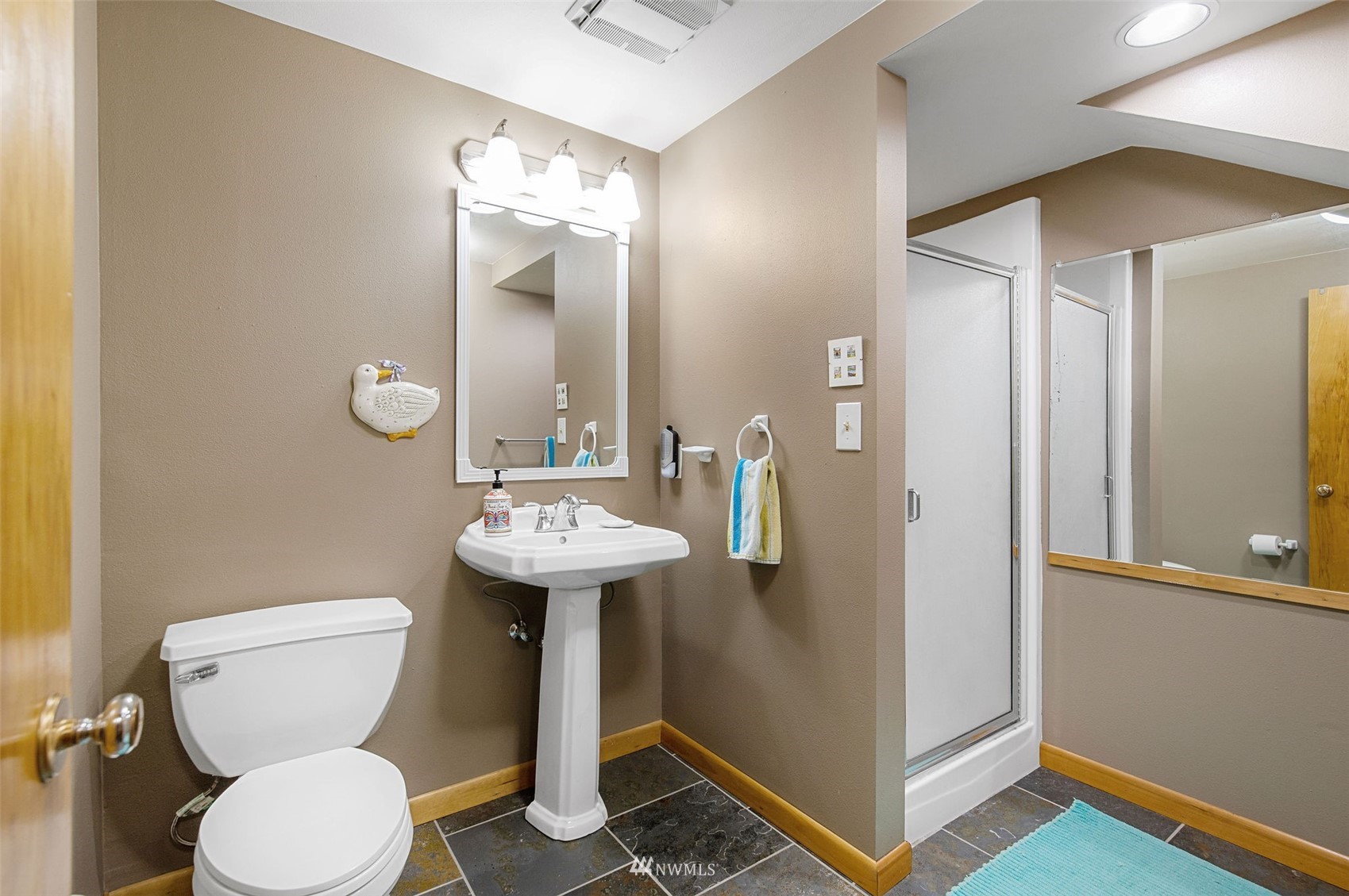 17510 88th Street Southwest Longbranch, WA 98351 - Photo 29 of 40 a bathroom with a toilet sink and mirror