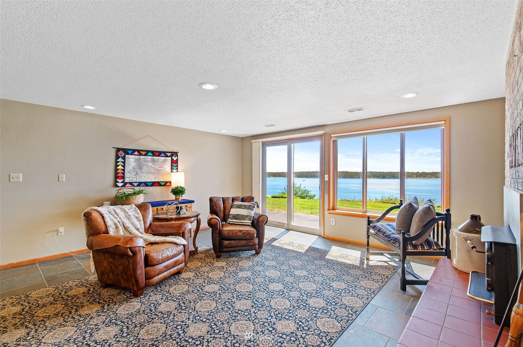 17510 88th Street Southwest Longbranch, WA 98351 - Photo 31 of 40 a living room with furniture floor to ceiling fan and a floor to ceiling window