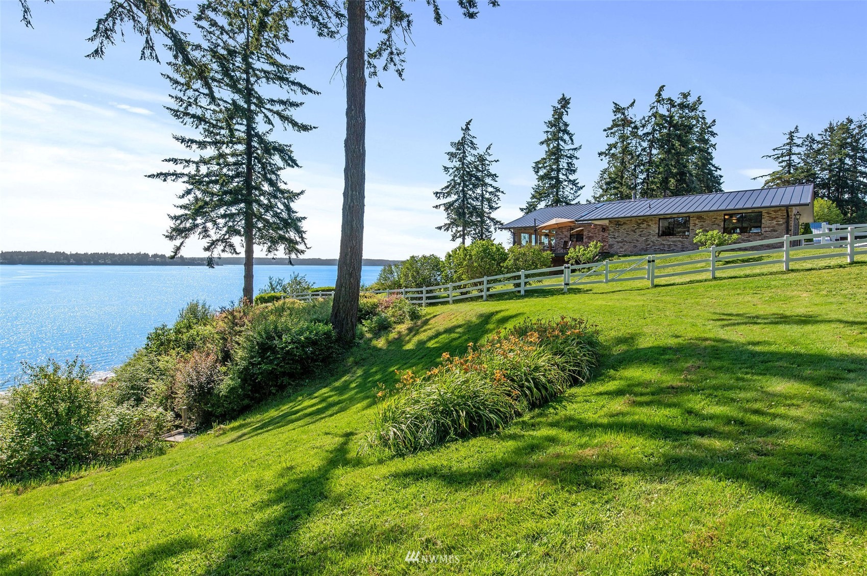 17510 88th Street Southwest Longbranch, WA 98351 - Photo 7 of 40 a view of a big yard with plants and large trees