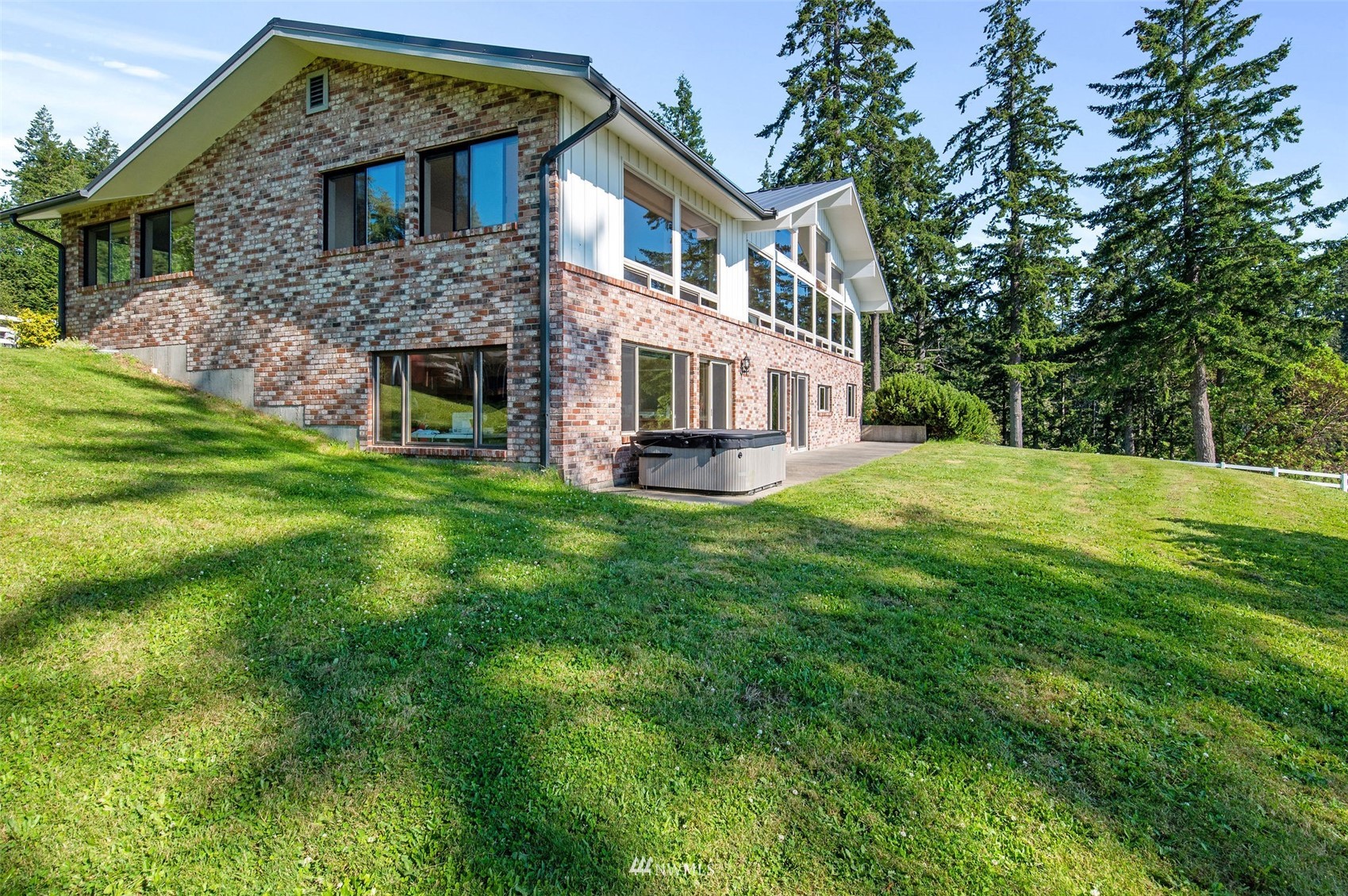 17510 88th Street Southwest Longbranch, WA 98351 - Photo 10 of 40 a front view of a house with a garden