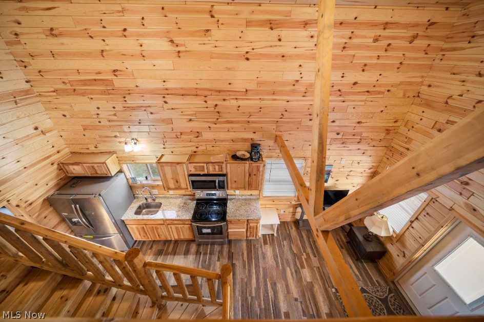 5919 Lake Road West, Unit 19 Ashtabula, OH 44004 - Photo 13 of 21 Kitchen featuring stainless steel appliances, light stone counters, wood ceiling, and dark wood-style flooring