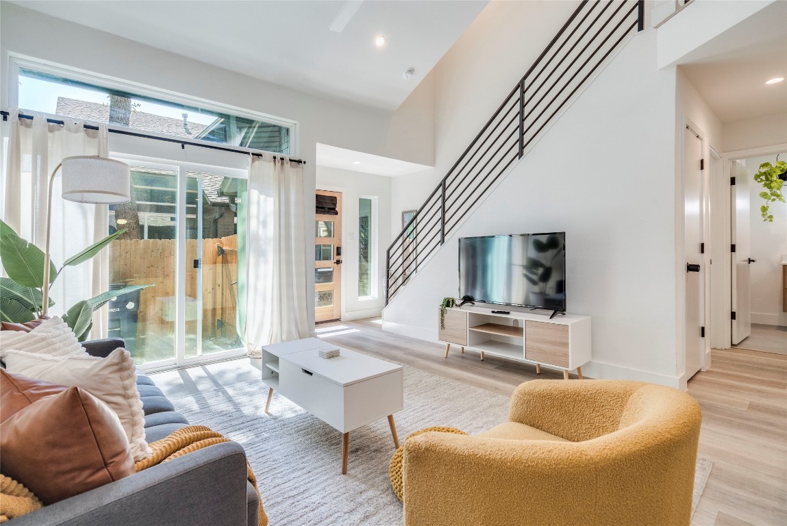 1902 Albury Cove, Unit C Austin, TX 78758 - Photo 2 of 25 a living room with furniture and a large window