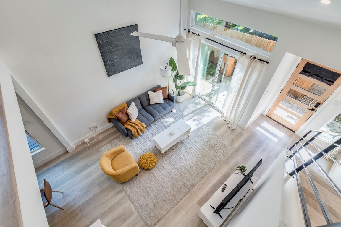 1902 Albury Cove, Unit C Austin, TX 78758 - Photo 8 of 25 a living room with couches and a flat screen tv